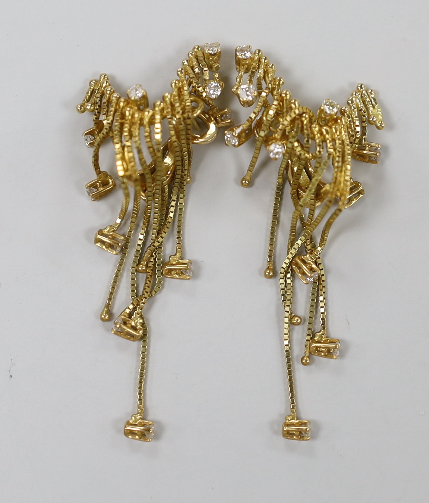 A pair of 1970's? yellow metal and diamond set tassel drop earrings, length approx. 64mm, gross weight 13 grams.